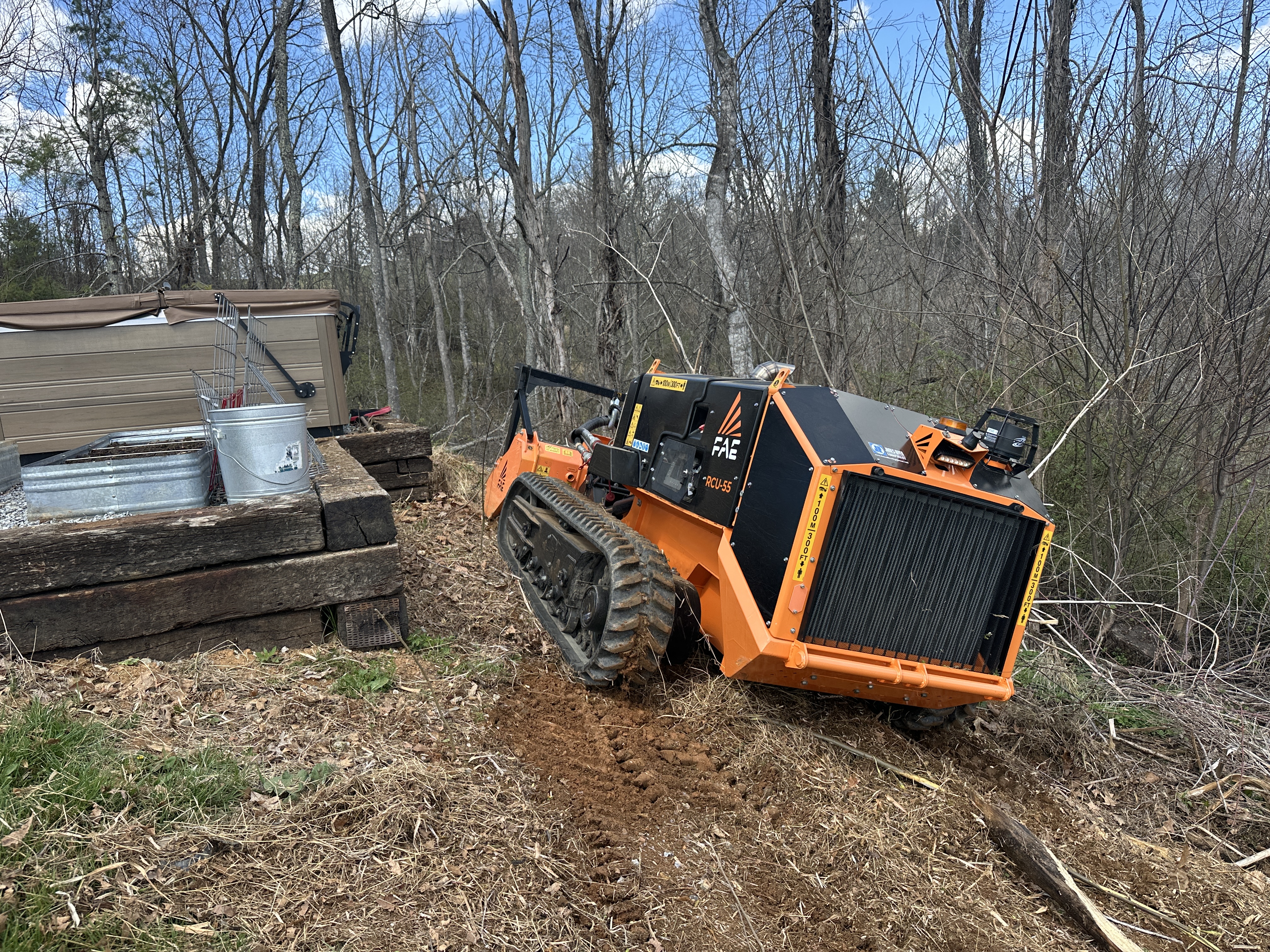FAE RCU-55 on steep slope next to retaining wall